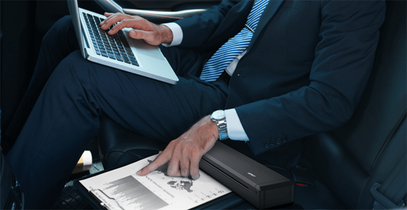 Portable printer in use while traveling