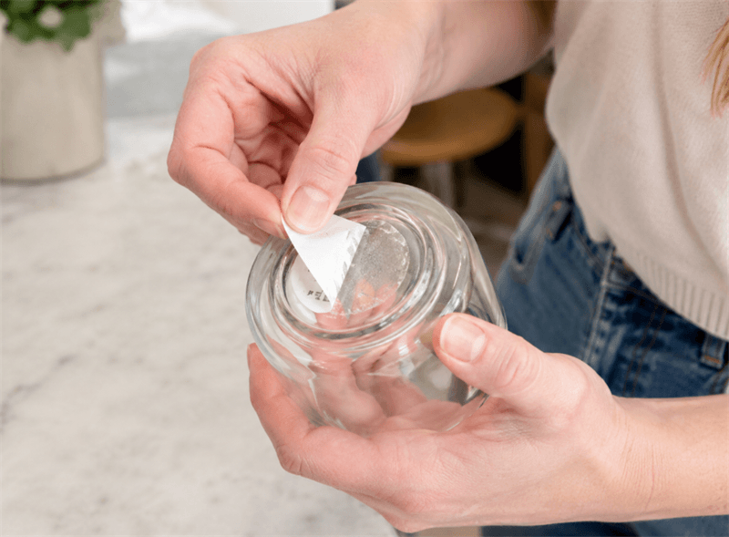 peeling-label-from-a-glass-cup