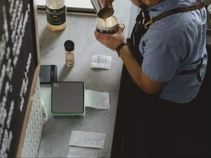 A modern cafe POS system with a tablet and ePOS printer.