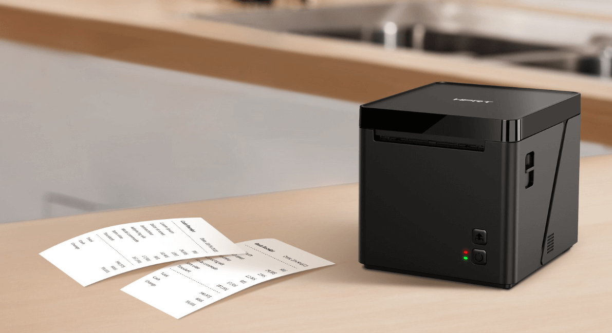 A compact thermal receipt printer on a retail counter.